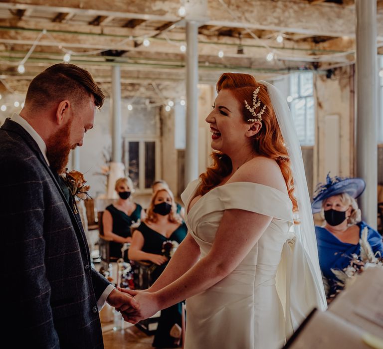 Bride and groom exchanging vows at Holmes Mill, Liverpool 