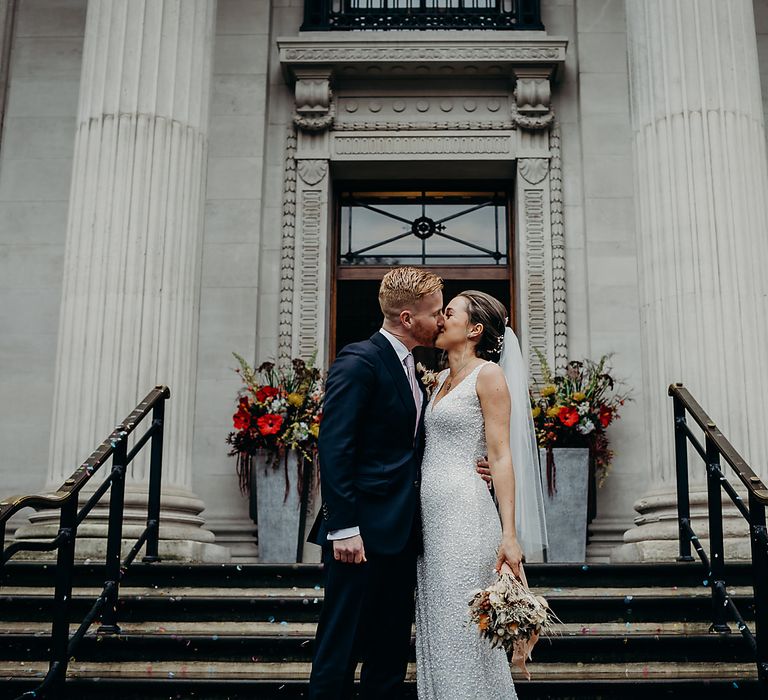 Bride and groom portrait on the steps at Old Marylebone Town Hall