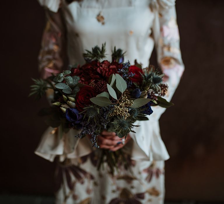 Beautiful thistle and rose wedding bouquet for Winter elopement