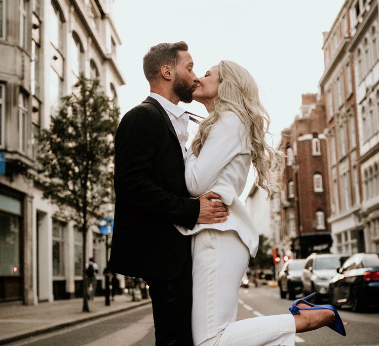 Bride & groom kiss on the streets of London