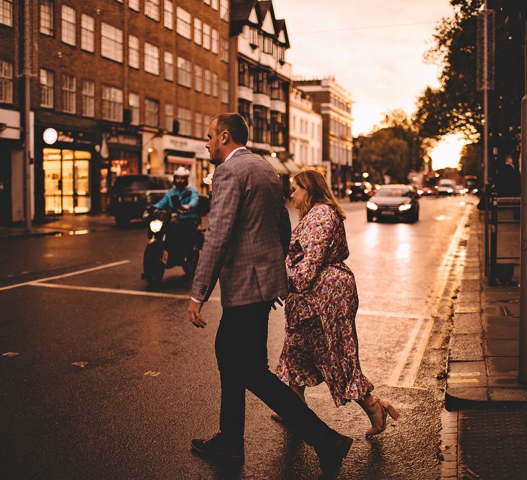 Bride & groom walk across the road in Chelsea after wedding ceremony