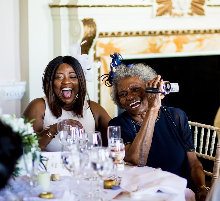 Wedding guests during elegant reception dinner at the Stowe House