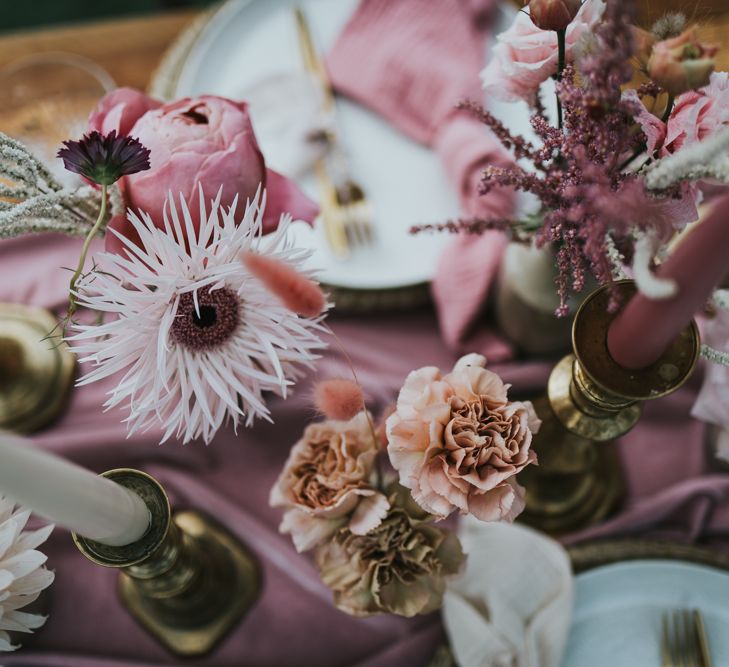 Blush and pastel pink wedding flowers and candles wedding table decor