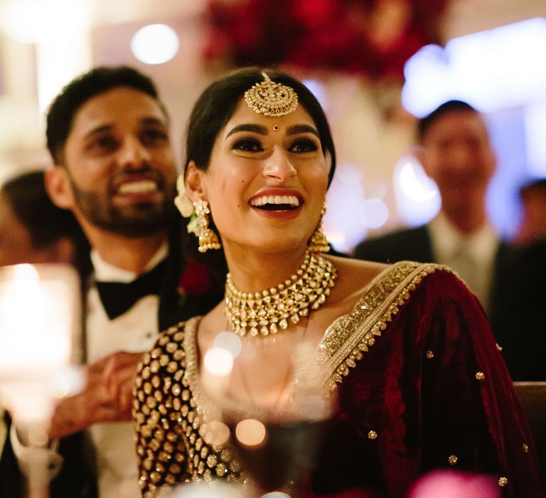 Bride & groom laugh during their wedding reception