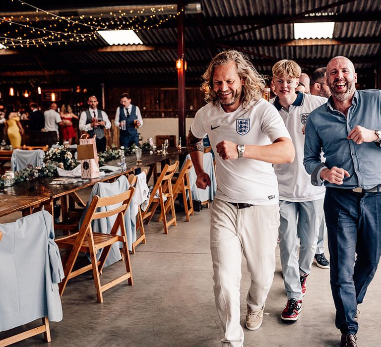 Groom and guests change into their England football shirts