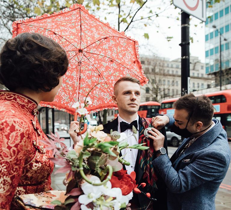 Groom in kilt prepares for town hall wedding