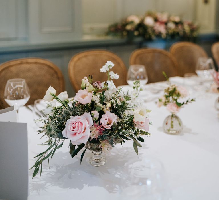 pink roses, foliage, thistle lisianthus and stock wedding flower centrepiece 