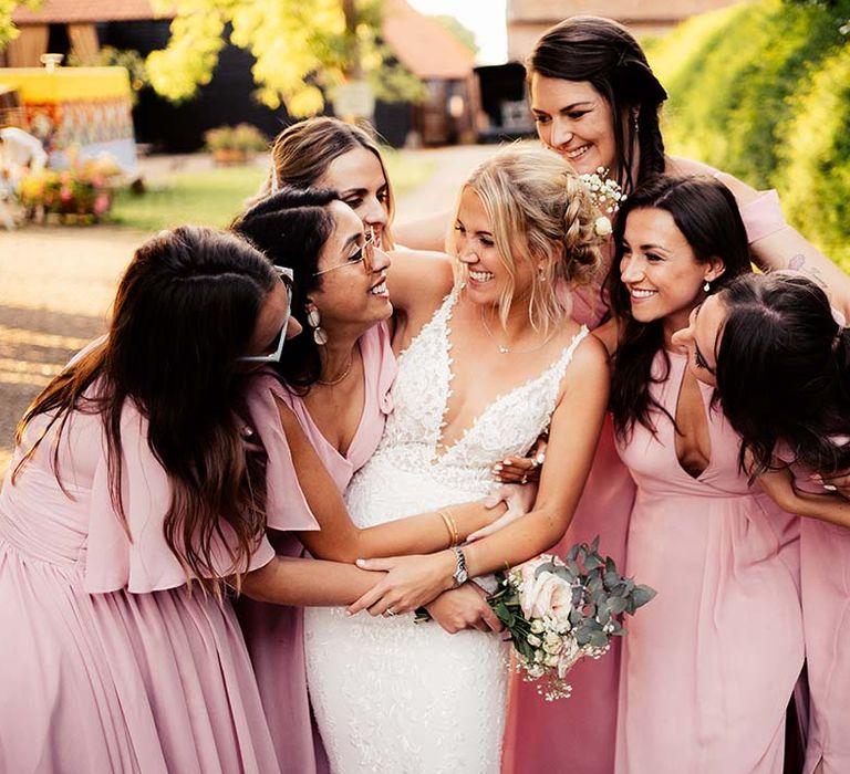 Bride with bridesmaids in pink dresses