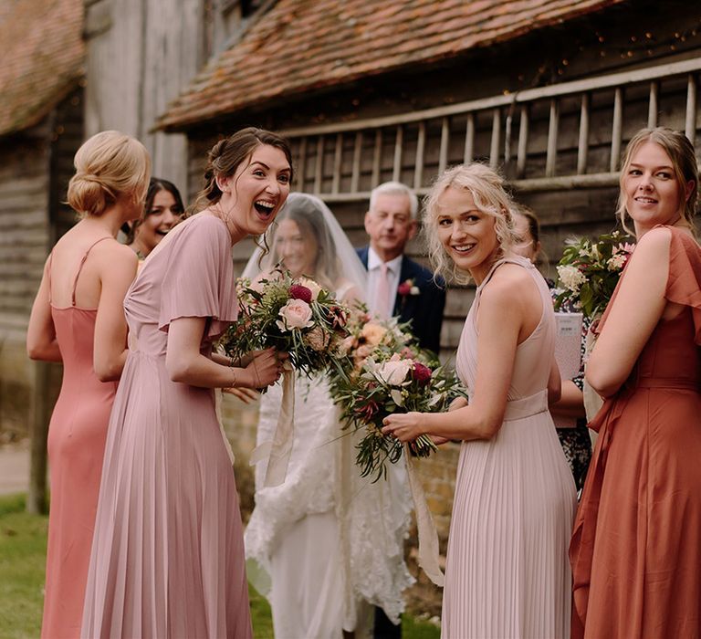 Bridesmaids in mismatched dresses at White Pond Farm wedding