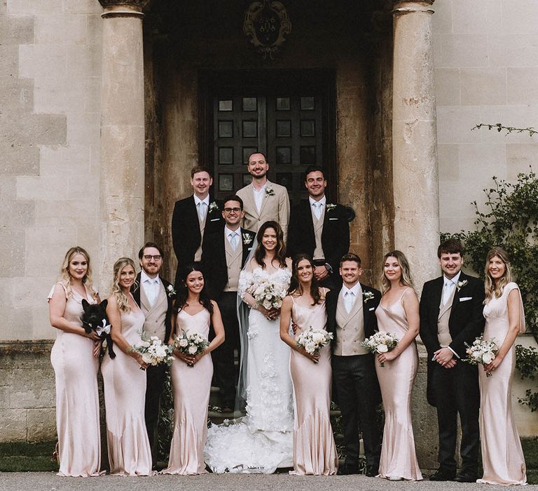 Light pink satin bridesmaid dresses and three piece suits