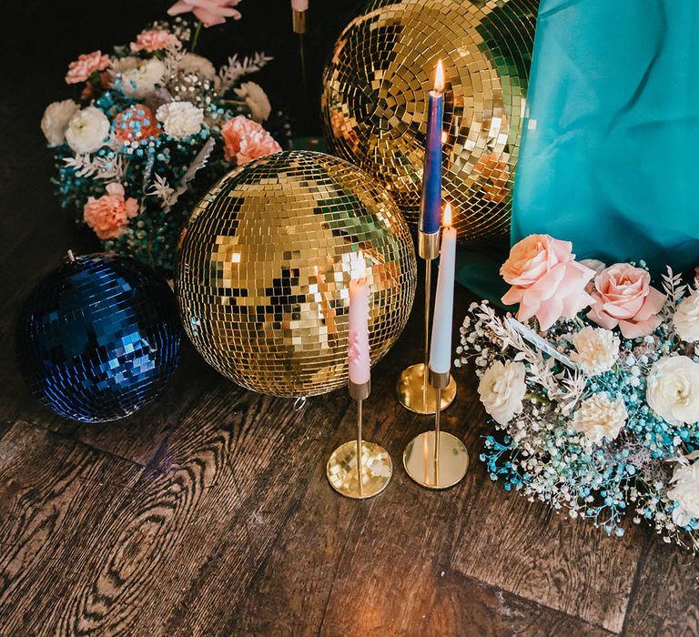 teal wedding inspiration with pastel pink flowers, gold candle sticks and glitter balls wedding decor 