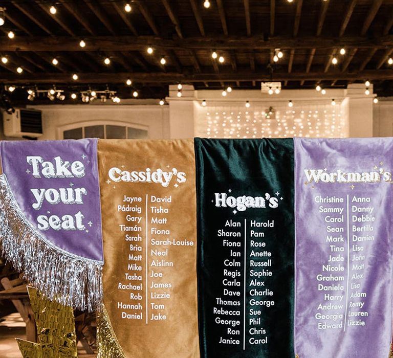 Fabric table plan with lilac, gold and black fabric and sparkly details 