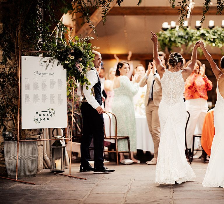 Brides enter their wedding reception