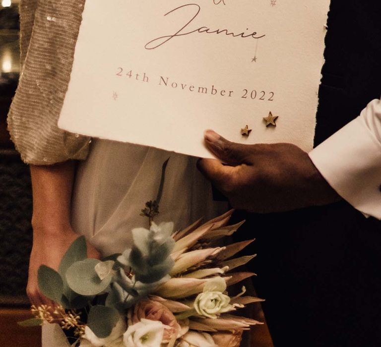 Minimalistic welcome wedding sign with appliqué stars and moon stickers and neat calligraphy