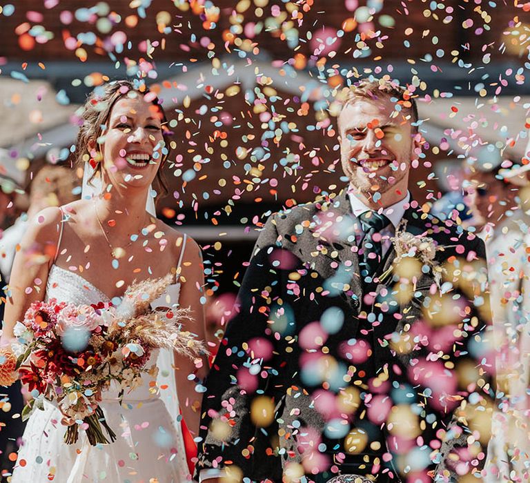 colourful confetti moment at The Kings Chapel, Old Amersham wedding ceremony 