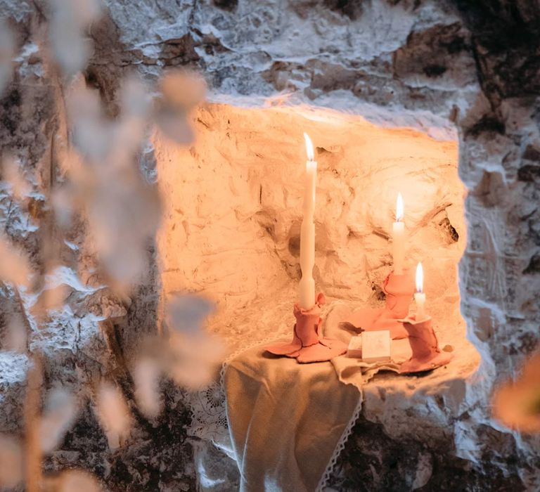 Twisted tapered candles in abstract clay candlestick holders at Margate Caves