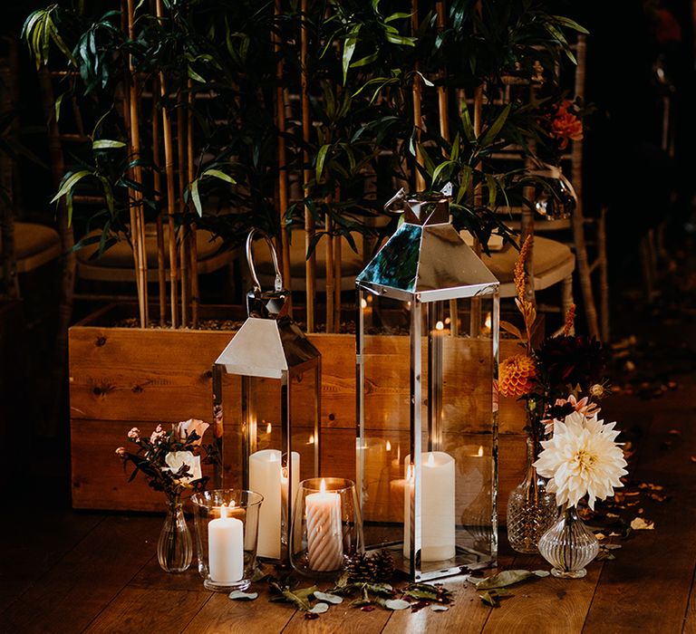 Glass lantern decorations with candles and cafe au lait dahlias for aisle wedding decor 