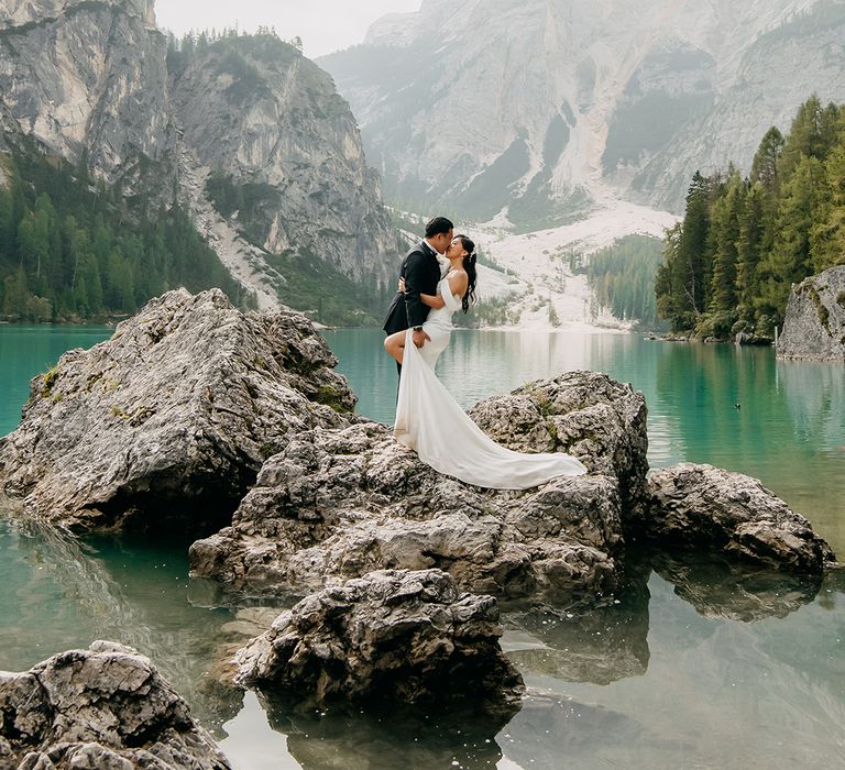 The bride and groom pose for couple portrait at destination wedding 