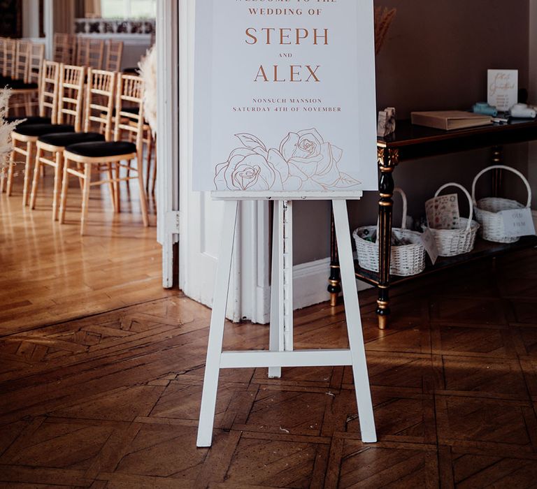 Wedding welcome sign at the entrance to the wedding ceremony room 