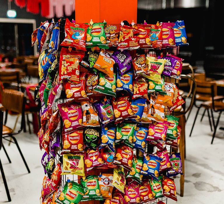 Crisp wall wedding favours for guests inspired by the couple's love for crisps 