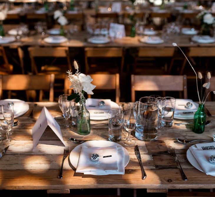 Wedding table place settings with disco ball wedding decor