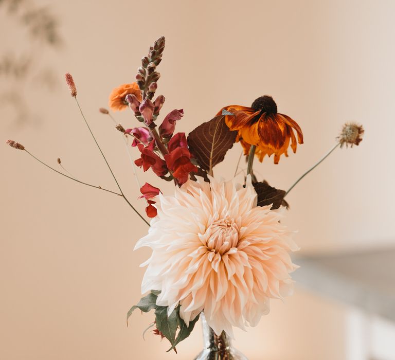 dahlia wedding flowers in bottles 