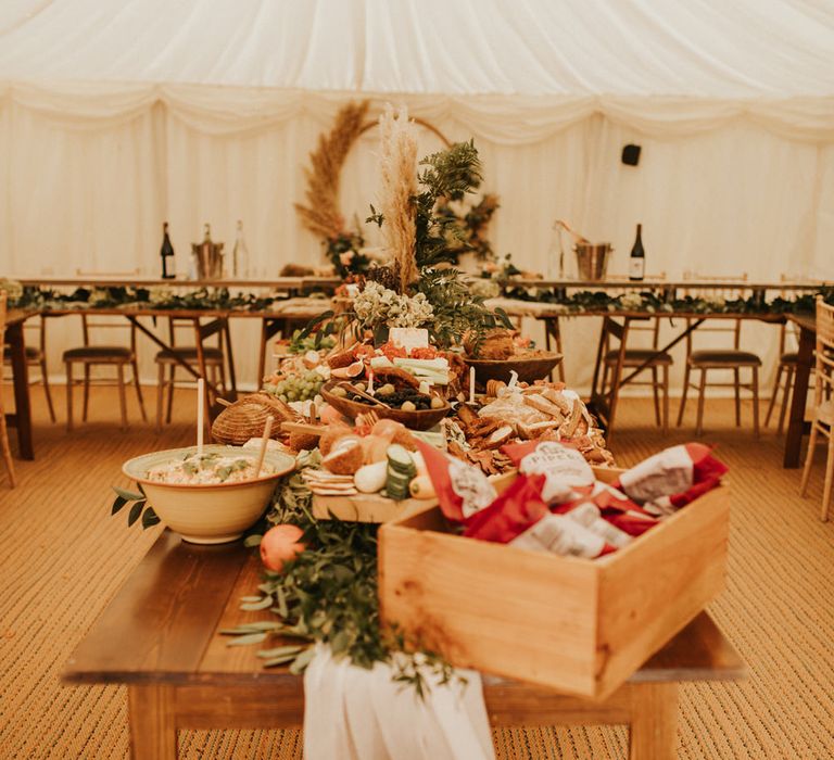 Central buffet table at marquee reception 