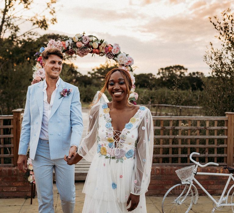 Bride in a flower embroidered wedding dress