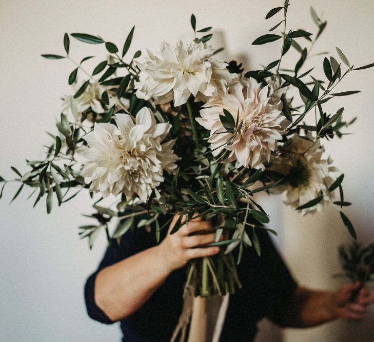 A huge boquet of olive branches and dahlias