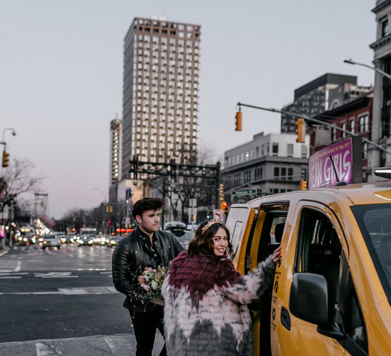 Bride & groom get into taxi in New York 