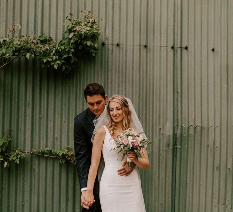 Bride and groom holding hands by Sam Cook Photography 