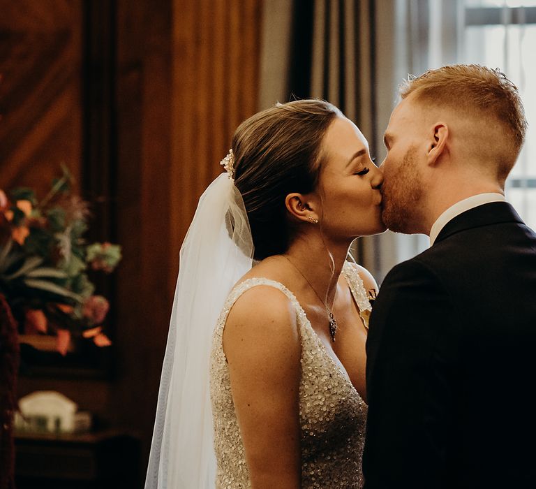 Bride and groom kissing at their Town Hall wedding 