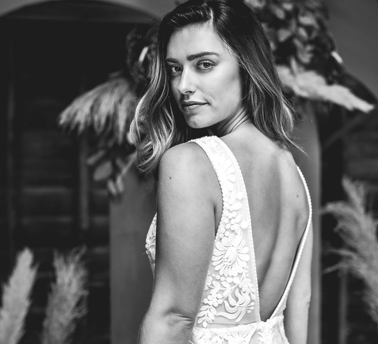 Bride looks back in black and white image