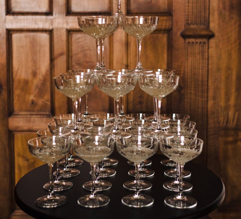 Champagne tower with crystal cut coupe glasses 