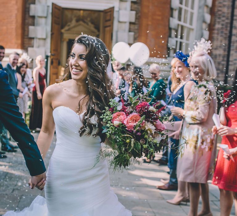 Confetti moment from bride and groom at London wedding in October