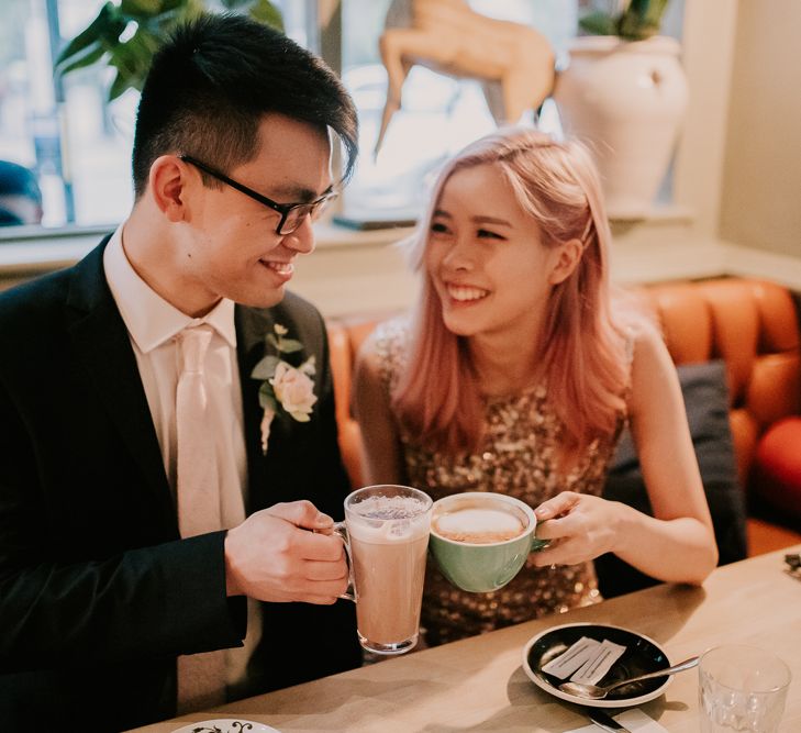 Bride and groom enjoying a coffee after their intimate Town Hall wedding 