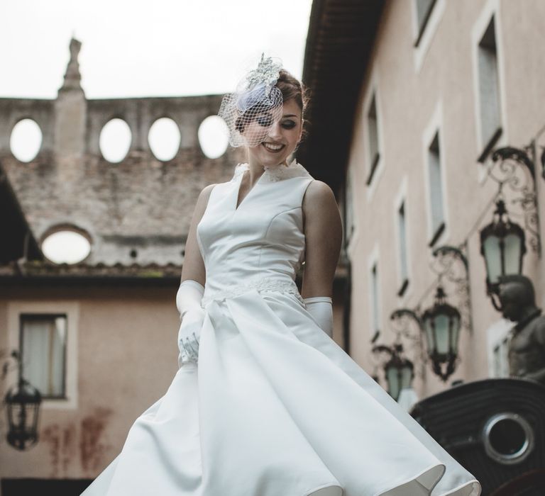 Bride twirling in her vintage style mid length wedding dress