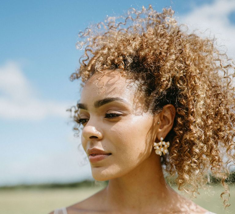 Natural wedding makeup and natural curly wedding hair for boho inspired bridal look