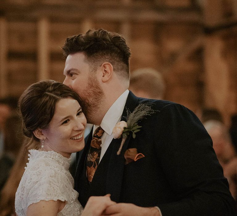 Bride and groom share a moment at The Barns at Redcoats