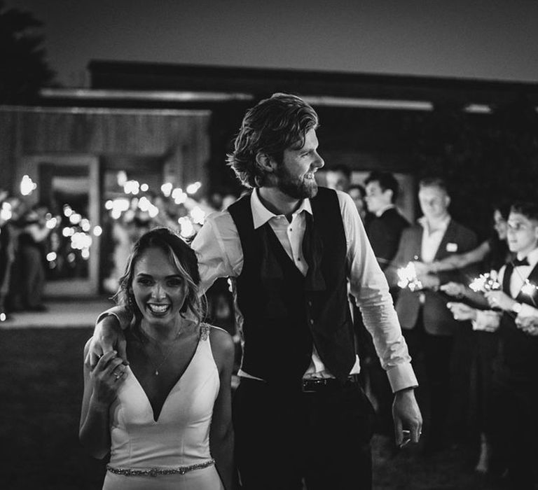 Black and white sparkler moment wedding photograph