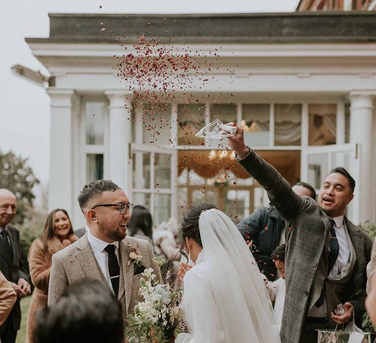 Pink confetti, white and neutral bridal bouquet, white veil and Vanesa Cocchiaro wedding dress