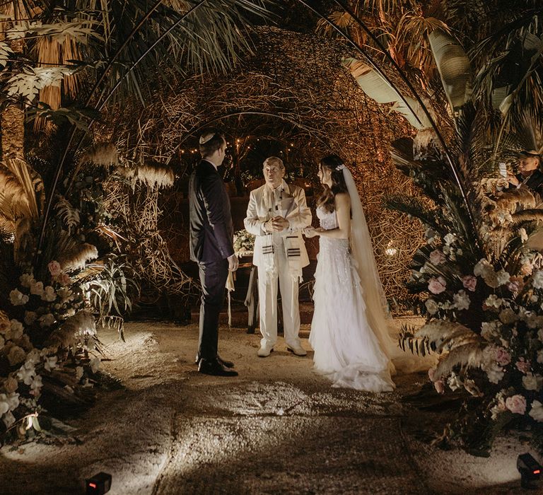 Bride & groom marry outdoors for cenote wedding in Tulum