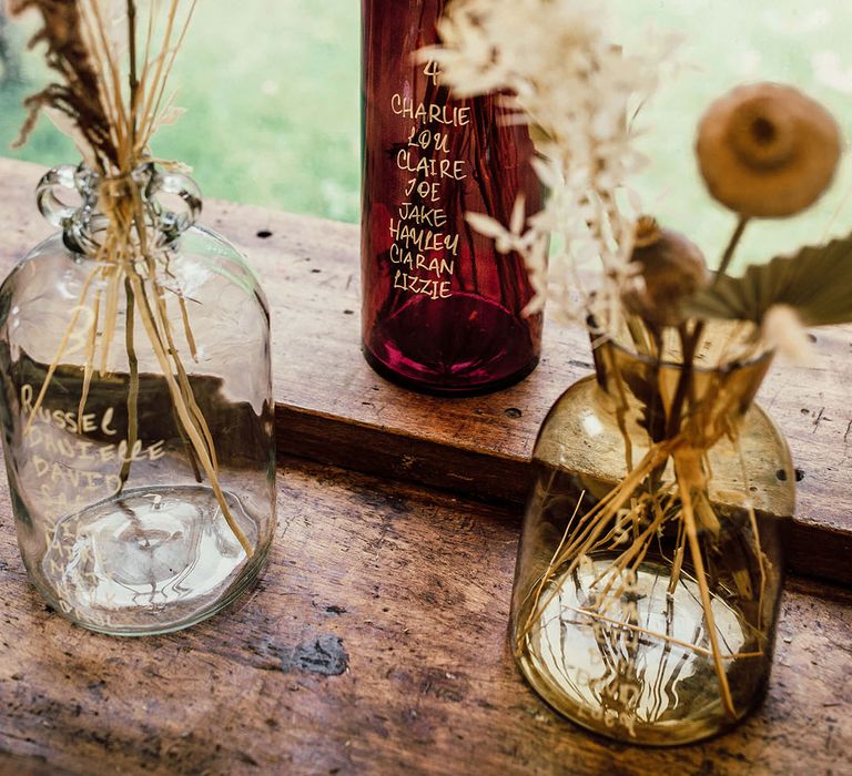 Vintage styled vases filled with pampas grass arrangements 