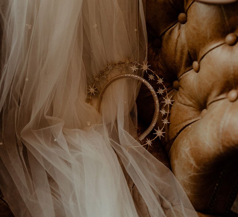 Gold and crystal starry bridal crown with the pearl veil, and studded wedding shoes 