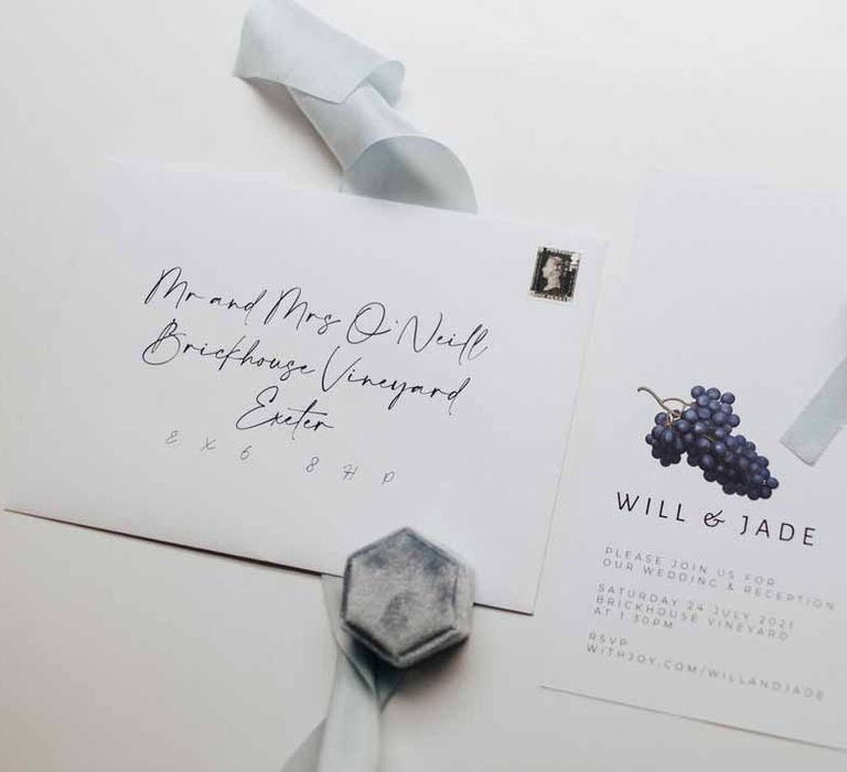 Minimalistic wedding white stationery with delicate grape detailing 