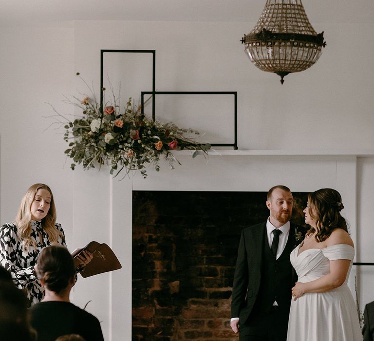 Aswarby Rectory wedding venue with pink rose wedding flower arrangements with black candle accents with a humanist celebrant wedding 