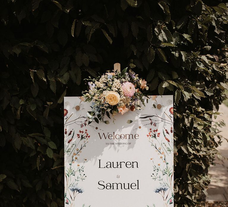 Wedding welcome sign design with colourful flowers for botanical style wedding 