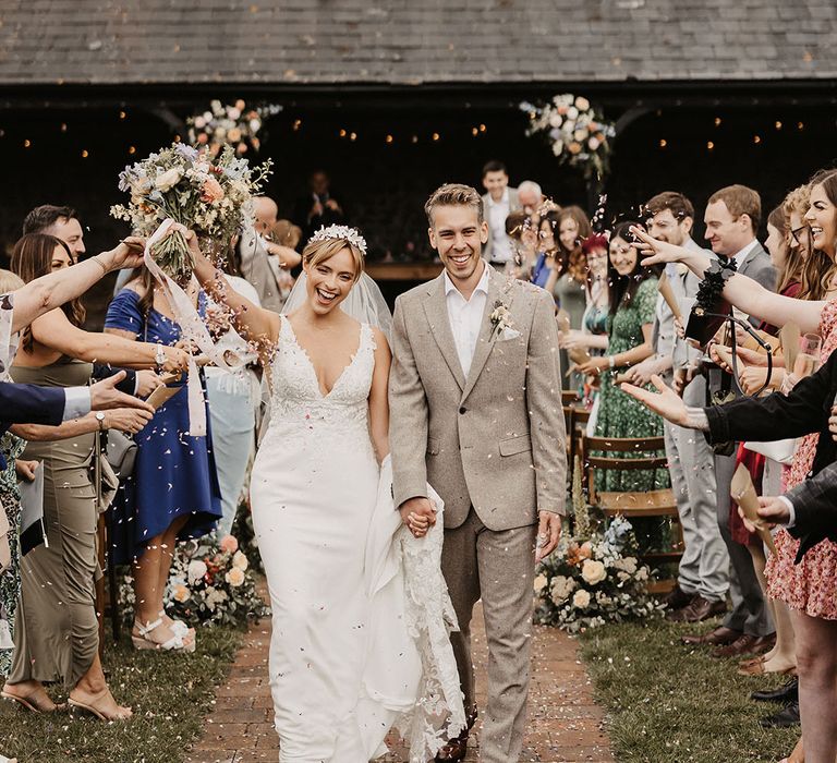 Confetti exit for the bride and groom as they exit from their non-denominational wedding ceremony 