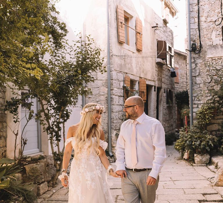 Croatia wedding with the bride and groom posing for their couple portraits with a boho pastel theme 