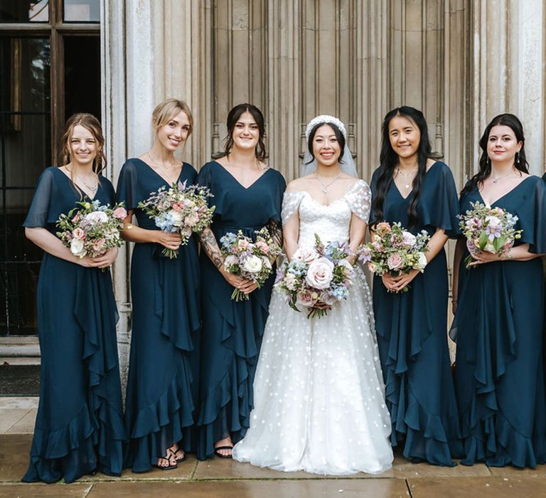 Bridesmaids wearing navy blue dresses at Ashridge House wedding